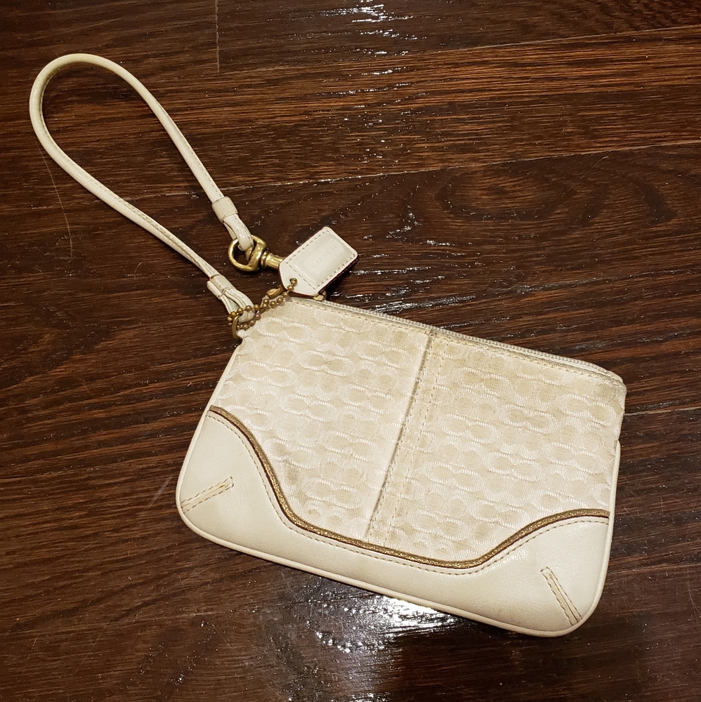 Coach white with gold trim wristlet